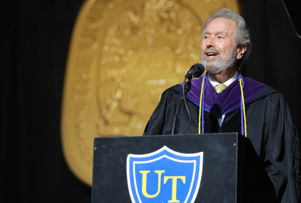 Steven Klar speaking at podium