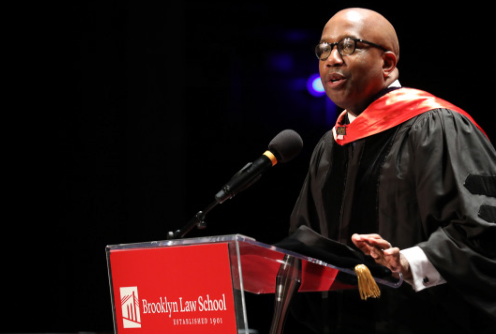 Errol Louis speaking at podium